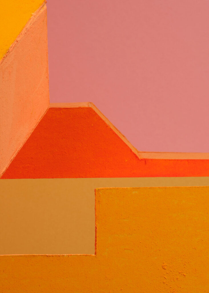 abstract colour study with geometric plaster forms in orange, pink, blue and yellow exploring shifting colour relationships and spatial perception